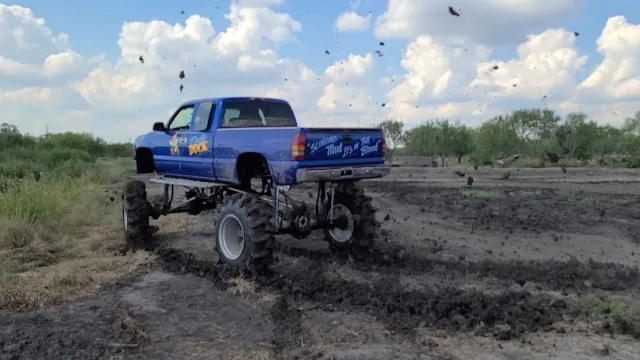 Monster truck spinning in the mud at 281 Country Club San Antonio