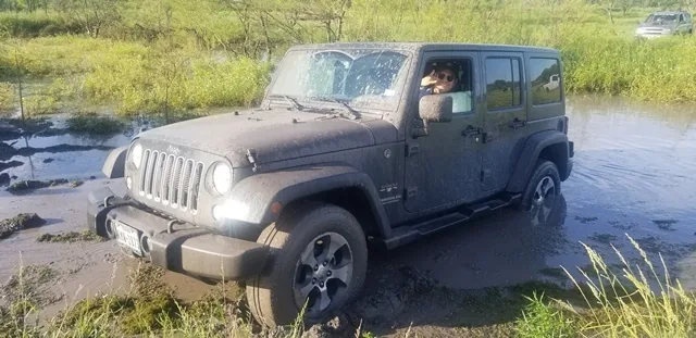 Jeep Wrangler deep in the mud pit at 281 CC offroad park San Antonio