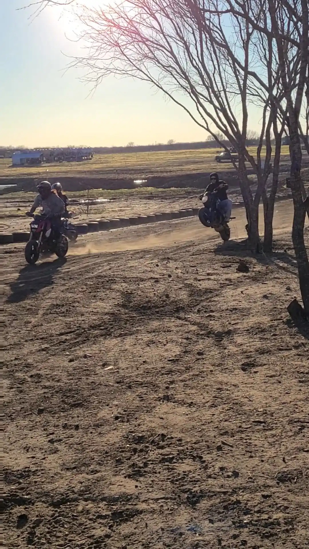 Two dirt bikes racing on the track at 281 Country Club offroad park