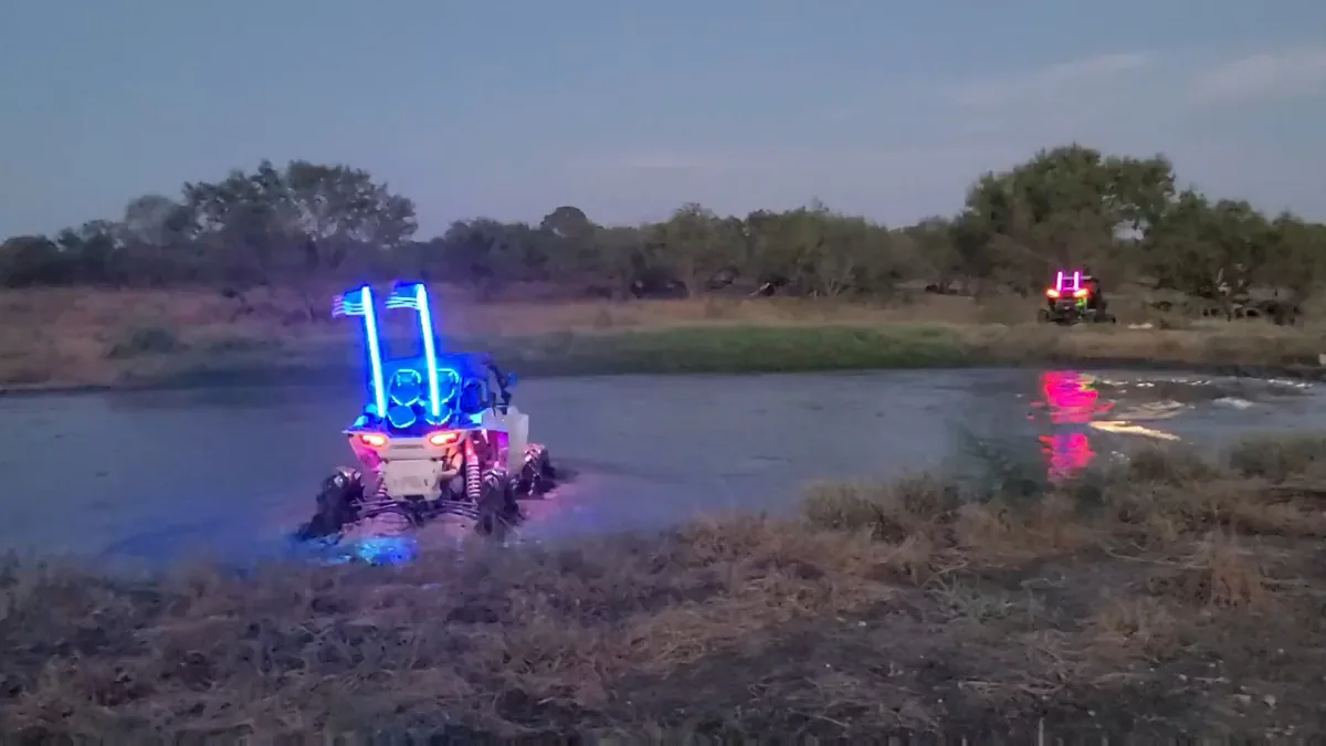 Two UTVs with LED lights crossing the pond at night at 281 CC San Antonio
